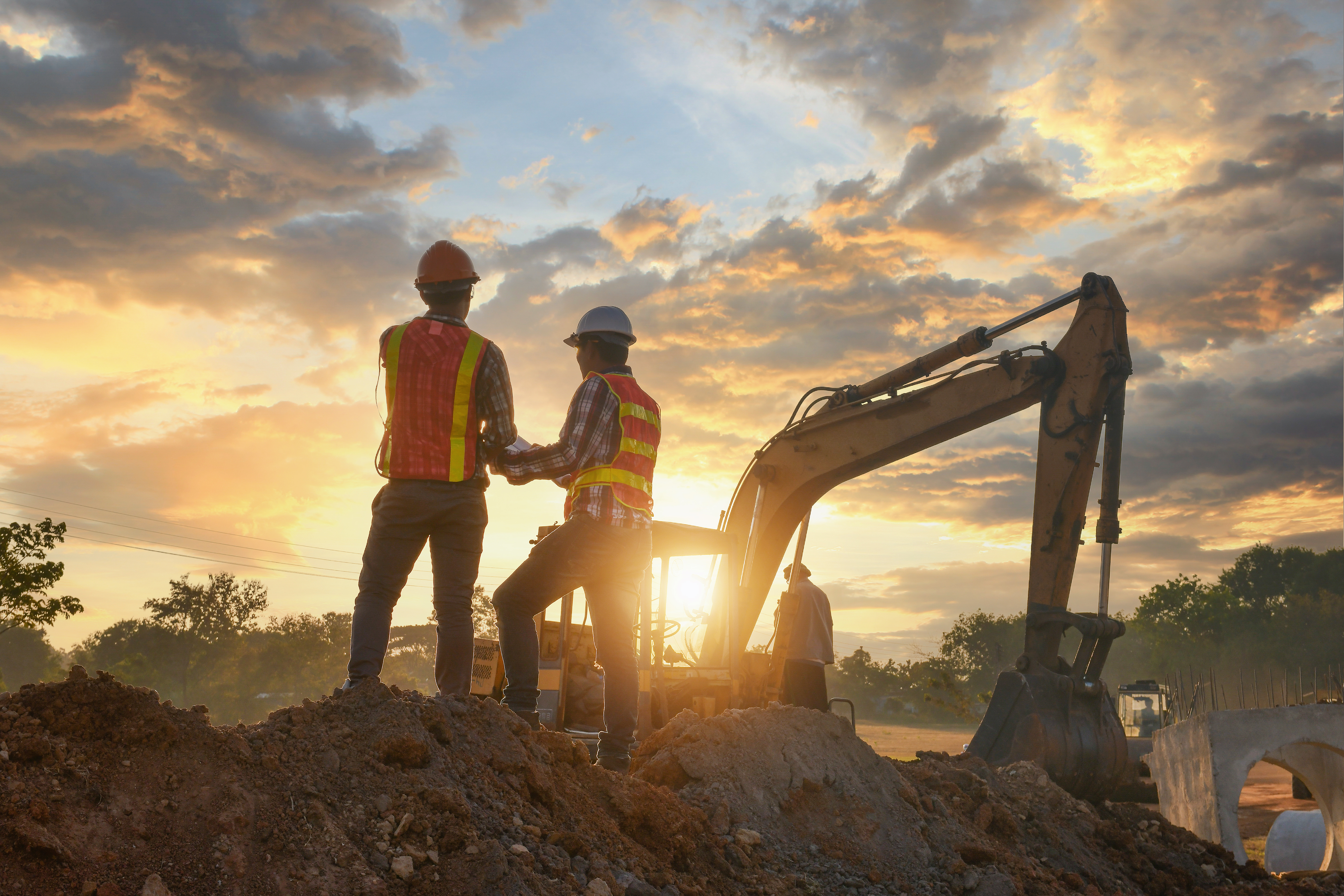 Construction engineers supervising progress of construction proj
